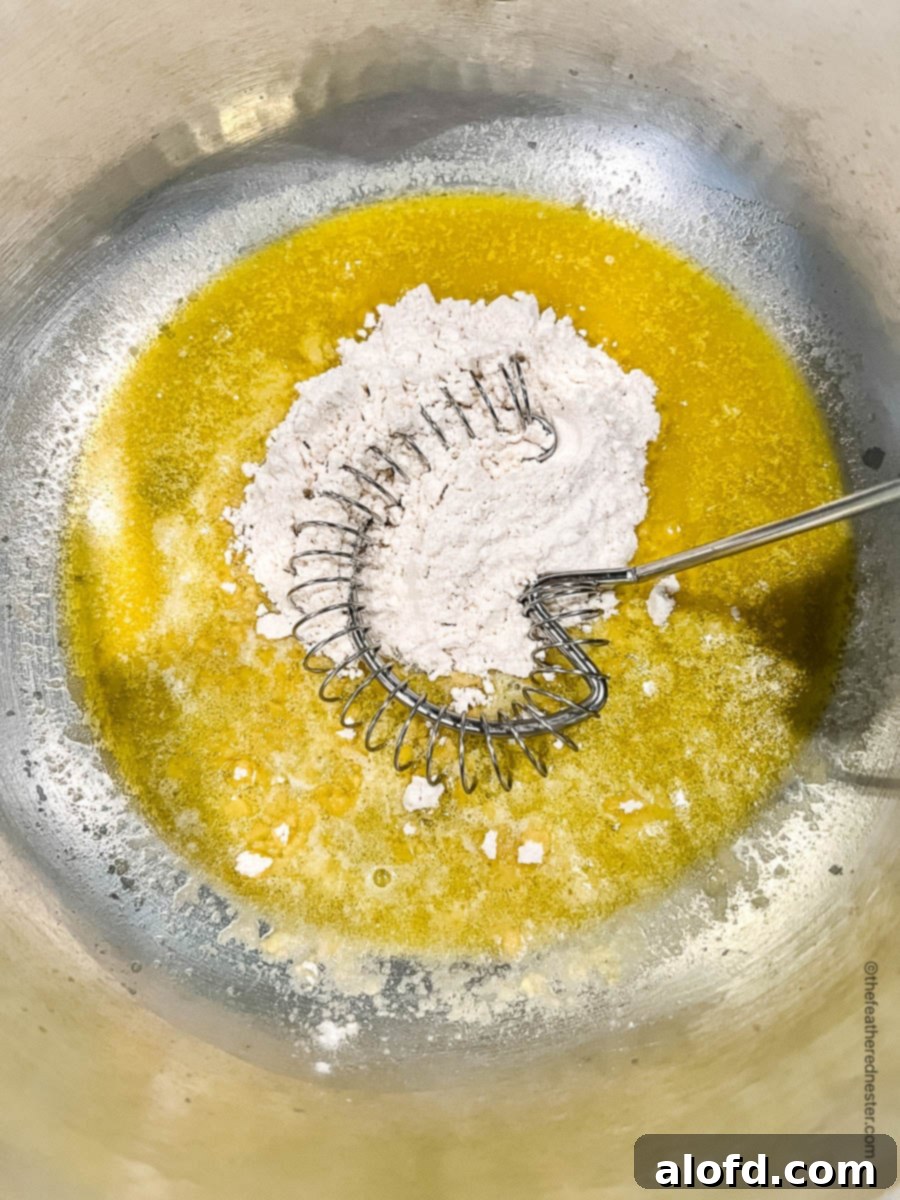 Velvety Cheese Béchamel 6 adding flour to melted butter in a saucepan.