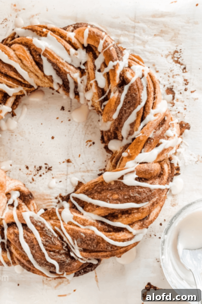 A beautifully baked pumpkin spice bread twist wreath, golden brown and ready to be glazed.