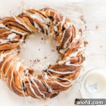 A freshly baked pumpkin spice twist on a parchment paper-lined baking sheet.