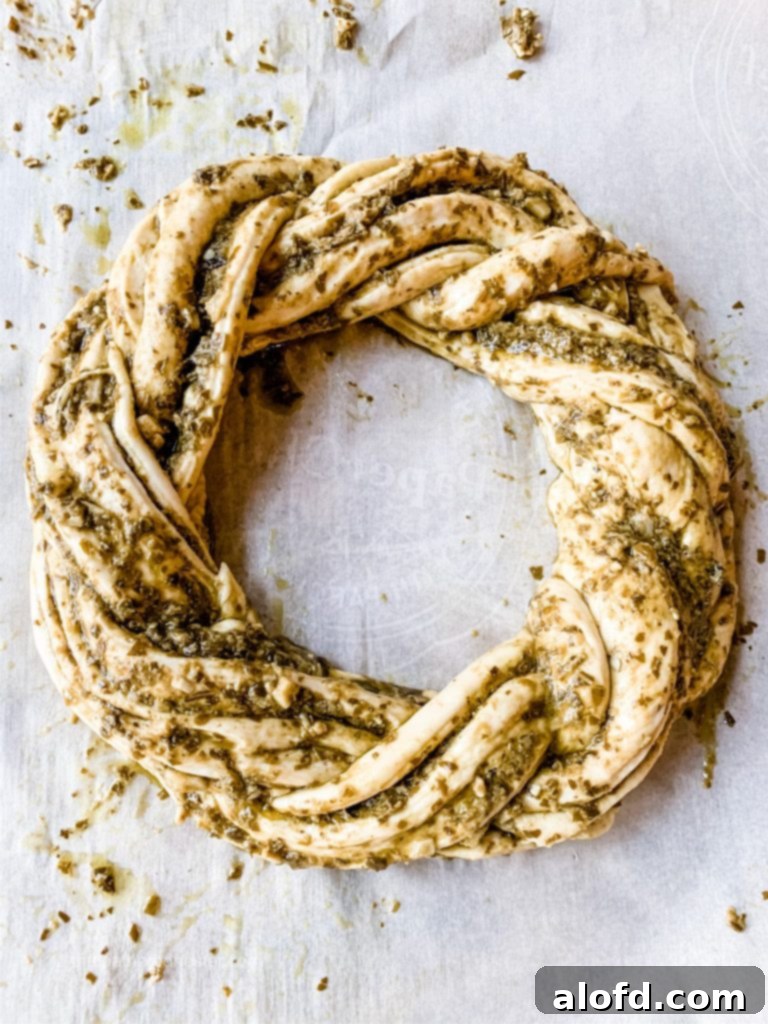 A savory pesto cheese bread twist, made from frozen dough, showcasing its beautiful braided shape.
