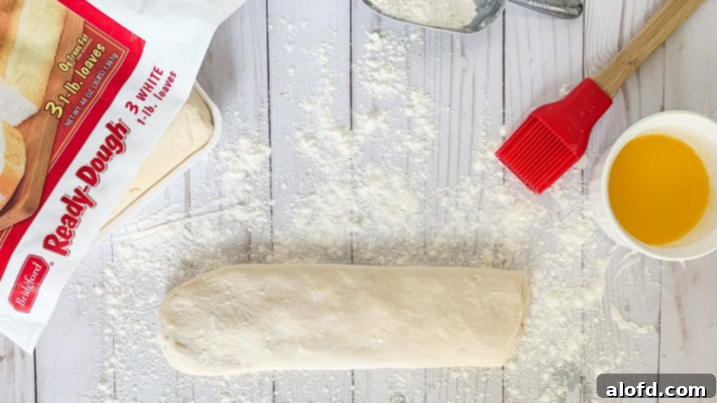 A single loaf of Bridgford Ready-Dough, thawed and ready for rolling.
