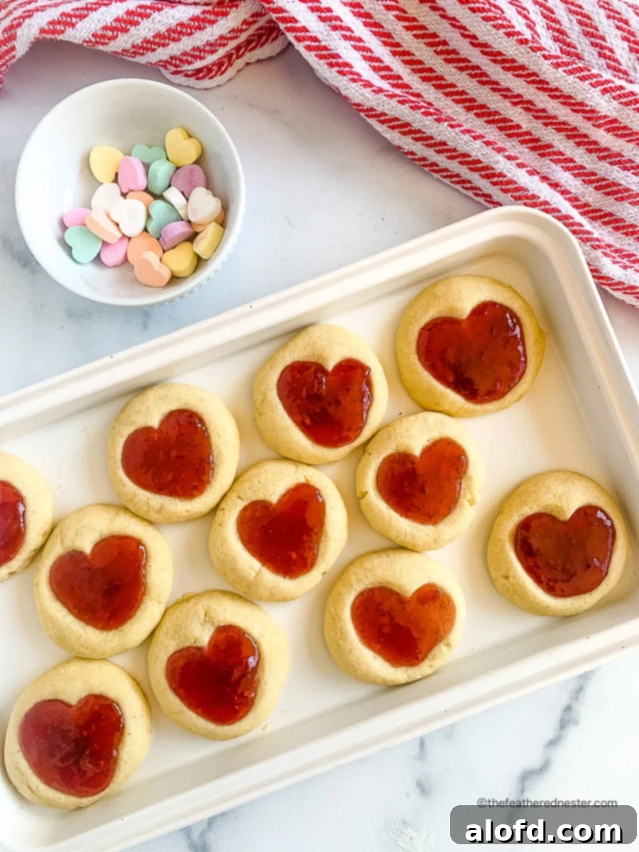 Platter of homemade Valentine treats next to a bowl of conversation hearts.