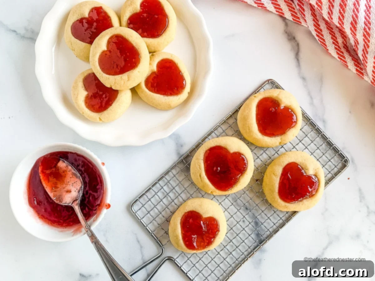 Heart cookies on a plate and on a cooling rack.