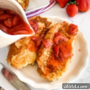 Luscious Strawberry French Toast 13 pouring syrup over homemade strawberry French toast.