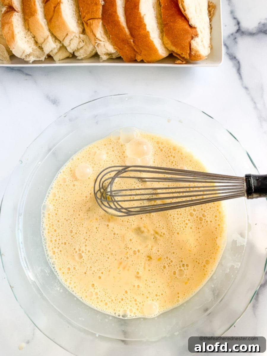 Luscious Strawberry French Toast 6 Eggs, milk, and sugar whisked together in a large glass bowl for French toast batter.