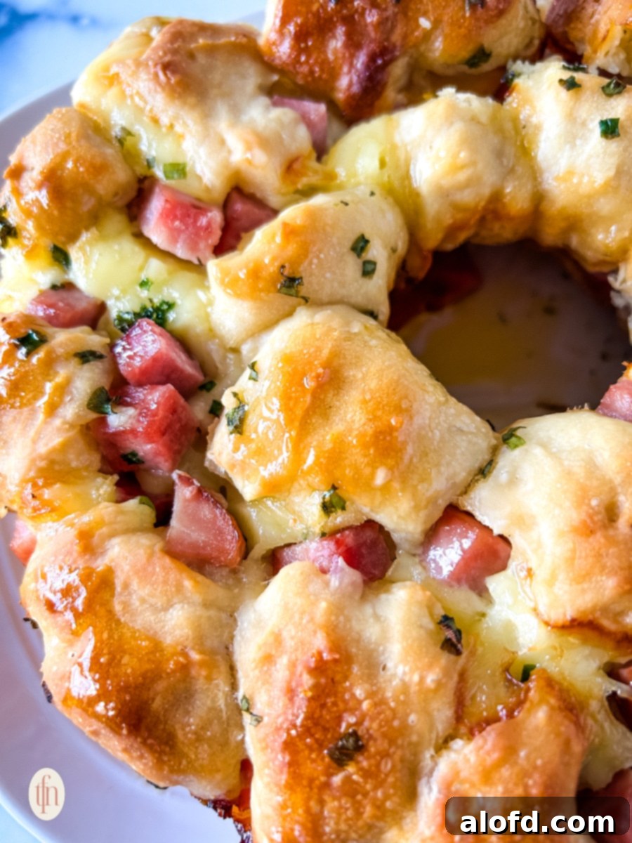 Close-up image of monkey bread with ham and brie.