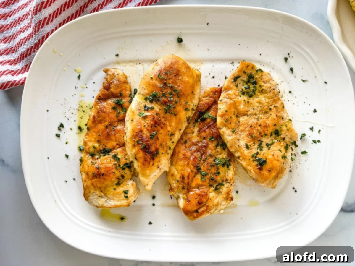Perfectly Seared Cast Iron Chicken Breast 11 Four juicy cast iron chicken breasts, plated.