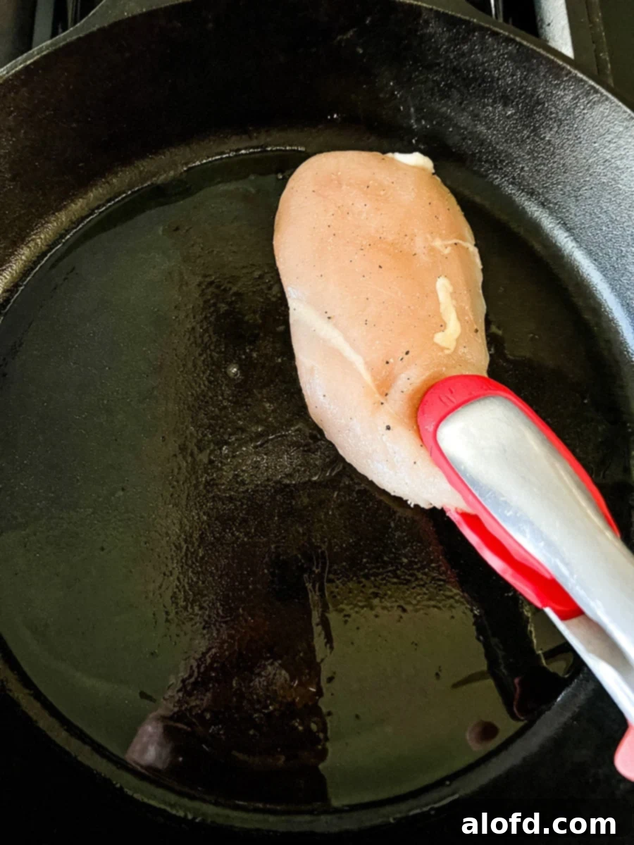 Perfectly Seared Cast Iron Chicken Breast 5 Pan searing chicken breast in cast iron.