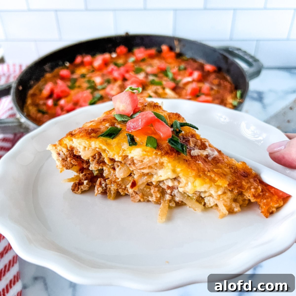 A plated slice of Bisquick breakfast casserole ready to serve