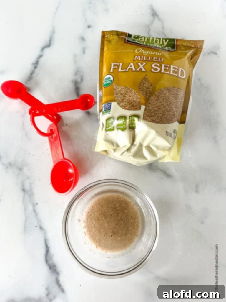 8 Simple Swaps for Egg-Free Cornbread 4 Flax egg substitute for cornbread in a small glass bowl. Package of flax seed next to it.