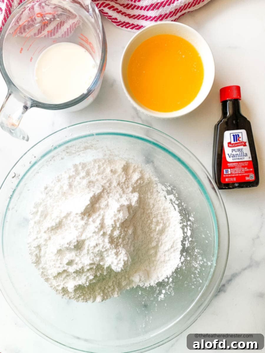 Fluffy Sourdough Discard Cinnamon Rolls 6 Bowls of heavy cream, melted butter, and powdered sugar, the ingredients for a rich sourdough cinnamon roll icing.