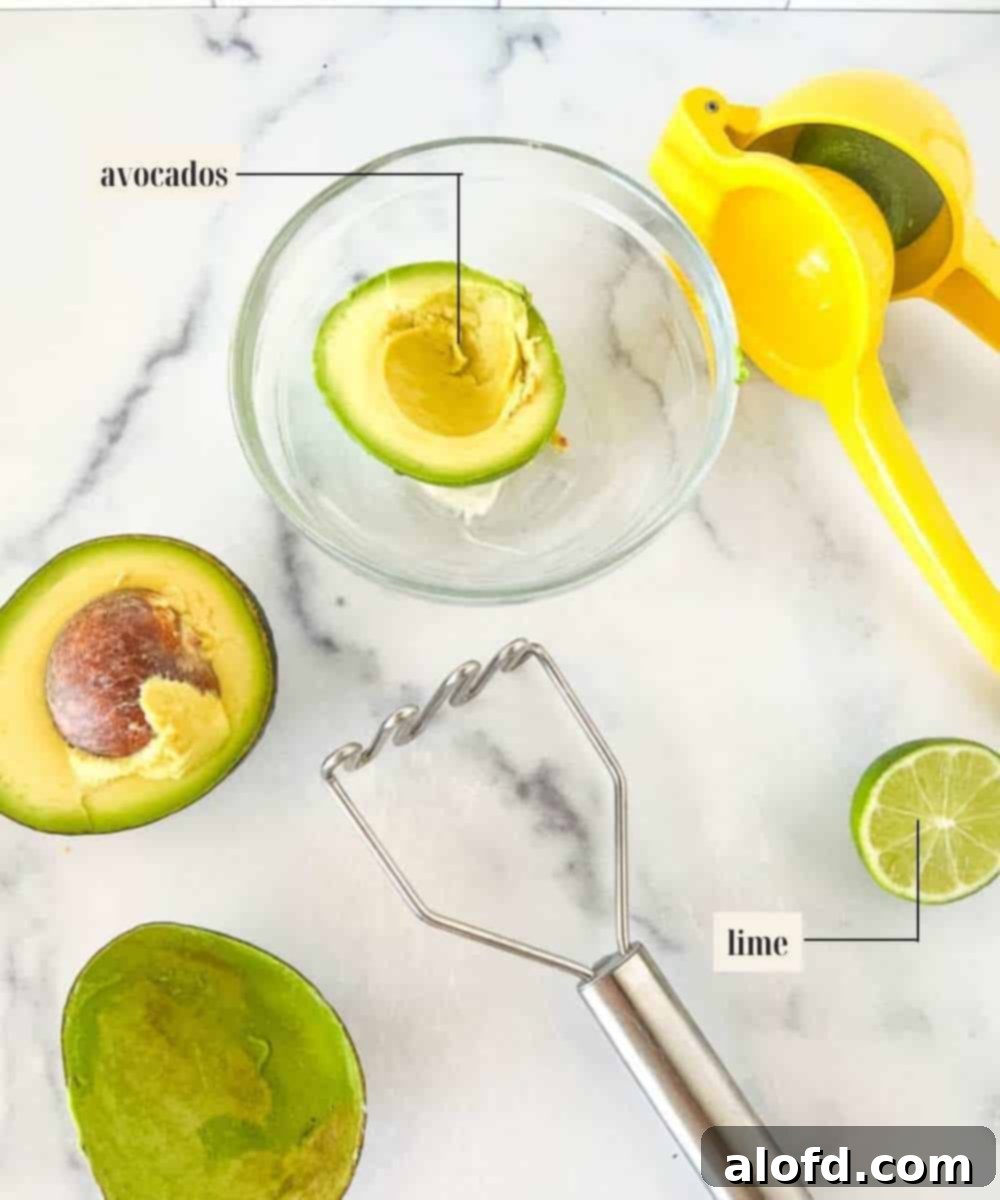 Velvet Avocado Spread 4 Labeled ingredients for making avocado spread: ripe avocados, lime juice, and sour cream.