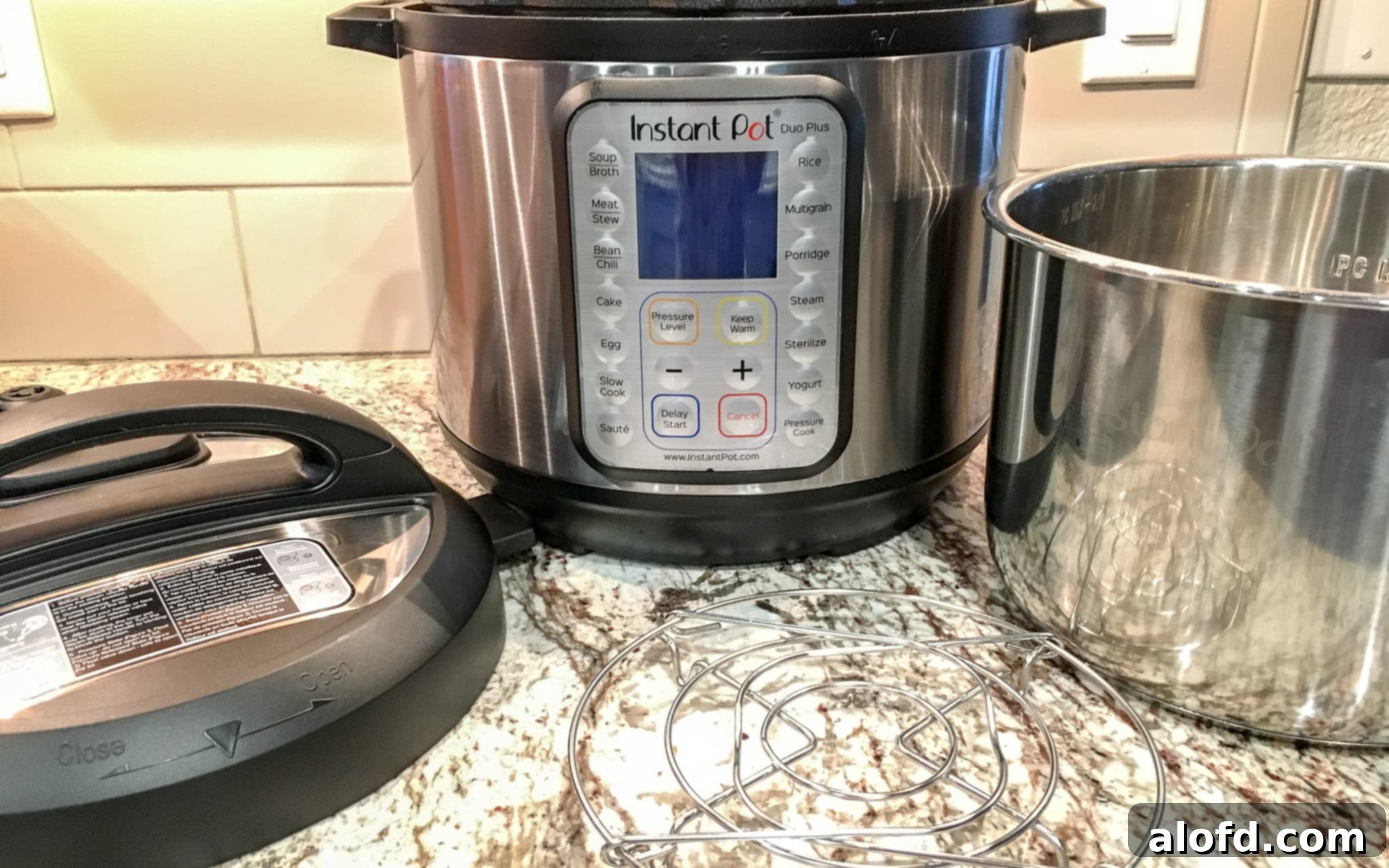 Speedy Savory Beef Stew 3 An Instant Pot Duo Plus and its accessories, showcasing a modern electric pressure cooker with various attachments for versatile cooking.