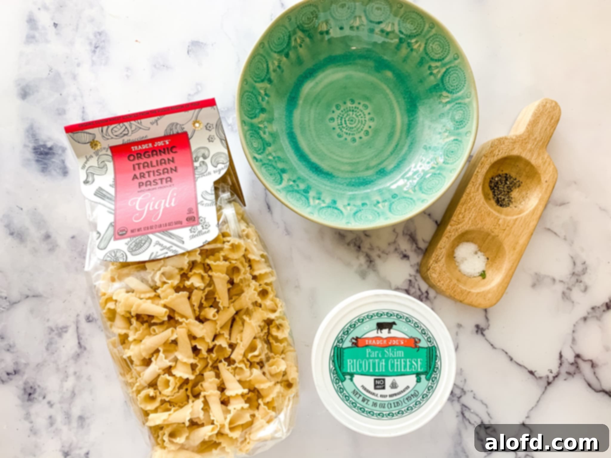 Hearty Instant Pot Lasagna Soup 7 Trader Joe's Gigli pasta and ricotta cheese with a green bowl.