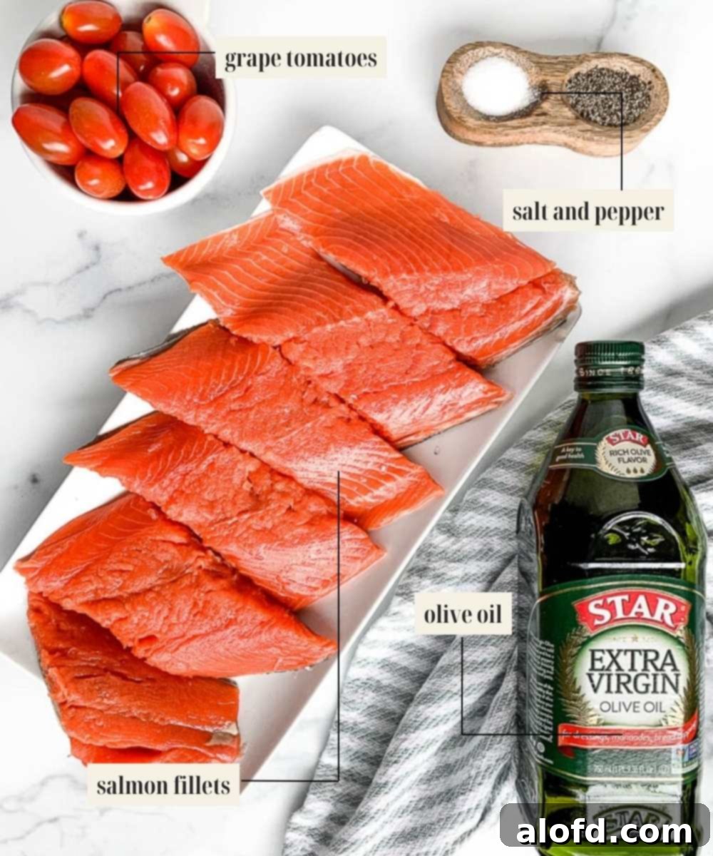 Bright Salmon Pesto Pasta 3 A vibrant flat lay of fresh ingredients for salmon pesto pasta, including salmon fillets, a jar of pesto, cherry tomatoes, and fresh basil leaves.