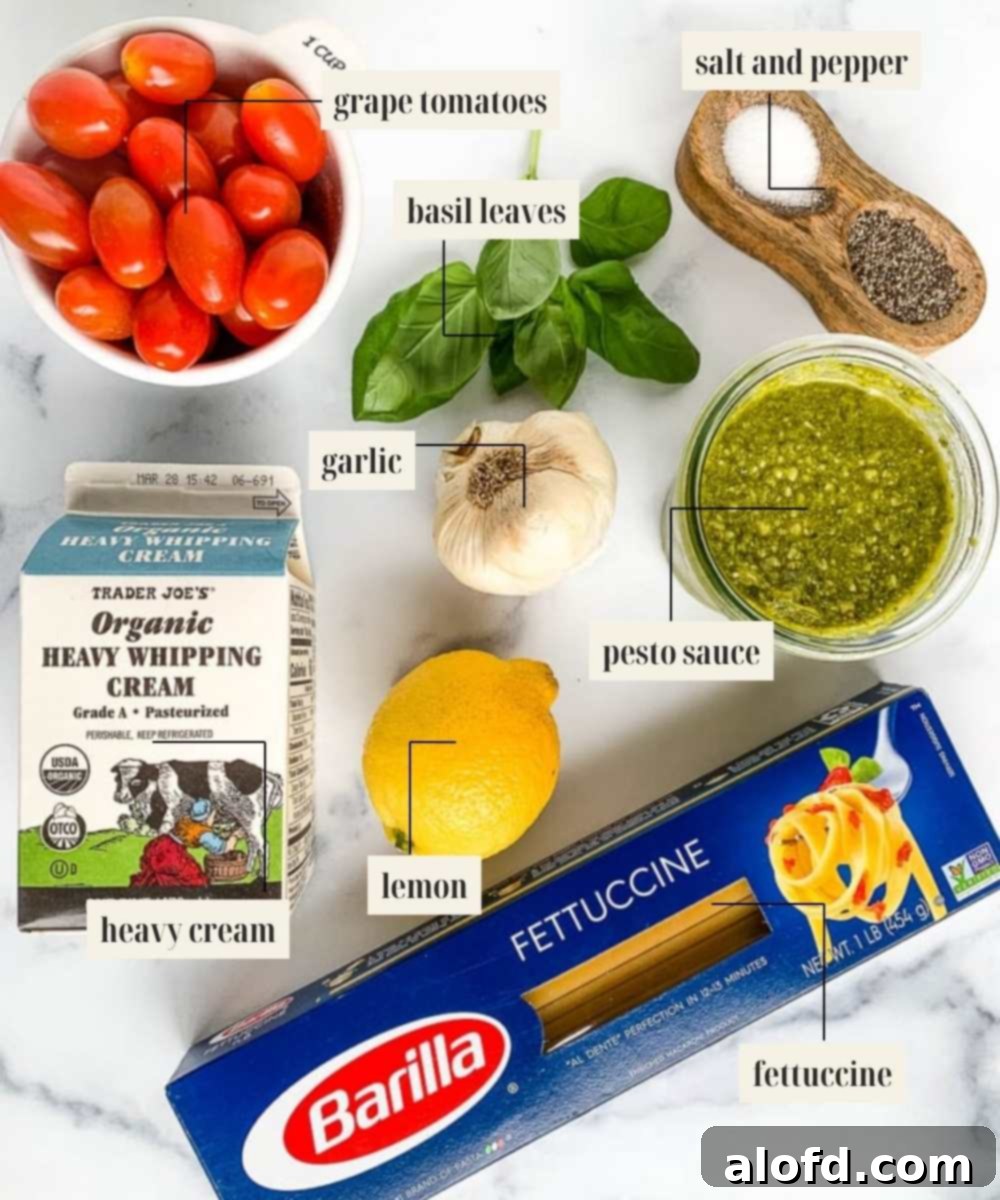 Bright Salmon Pesto Pasta 4 A selection of fresh ingredients including vibrant green pesto, plump cherry tomatoes, garlic cloves, and fresh basil for a delicious salmon pasta.