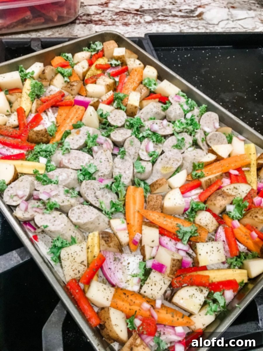 One-Pan Chicken Sausage and Roasted Vegetables 6 A ready-to-eat sheet pan of Bavarian-style sausage and a vibrant mix of colorful, roasted vegetables, beautifully cooked.
