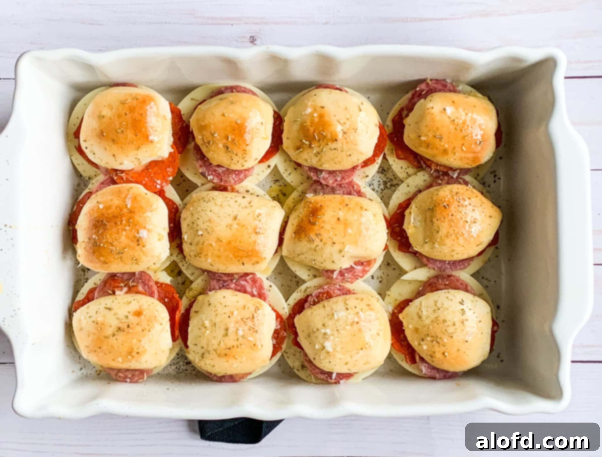 Zesty Italian Slider Bites 11 baked Super Bowl sliders filled with deli meats and cheese