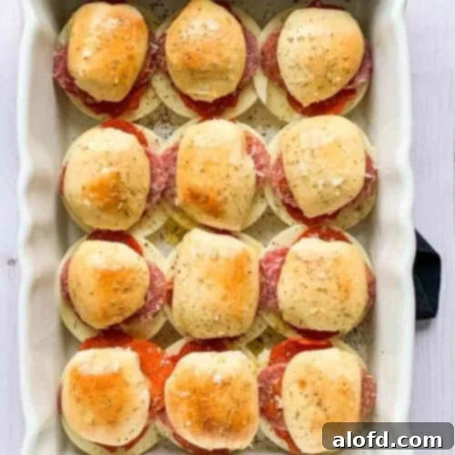 Zesty Italian Slider Bites 13 White baking dish filled with Italian sliders.