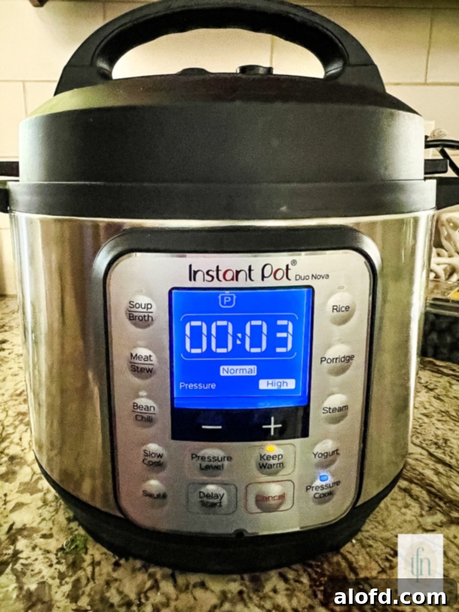 An Instant Pot displaying a 3-minute cook time for red lentils, indicating a quick and efficient cooking process for perfectly tender legumes.