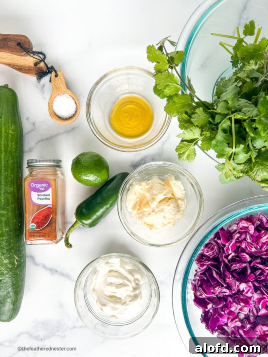Ingredients in small prep bowls and on a counter top to make summer coleslaw.