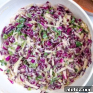 Overhead: taco slaw in a large white bowl.