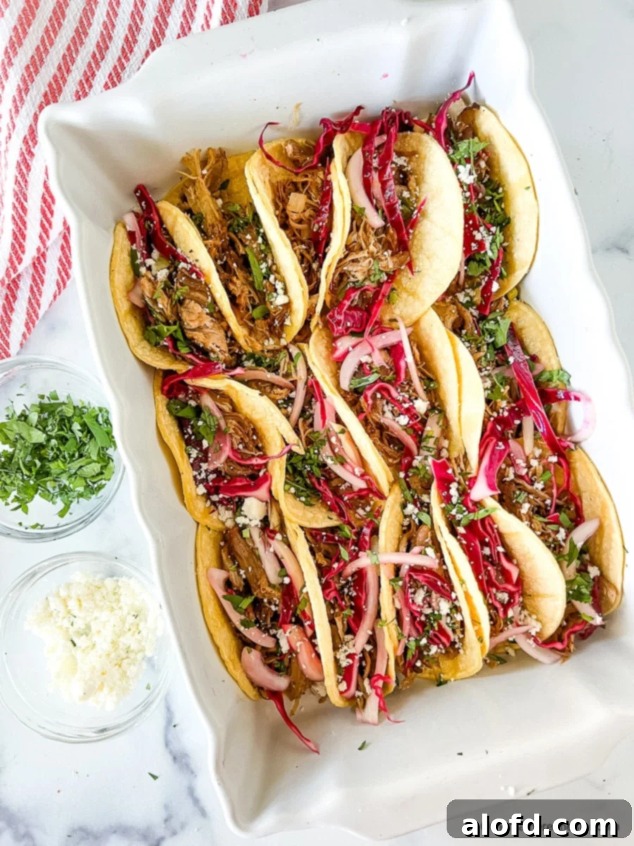 Pickled taco slaw served on top of pork street tacos.