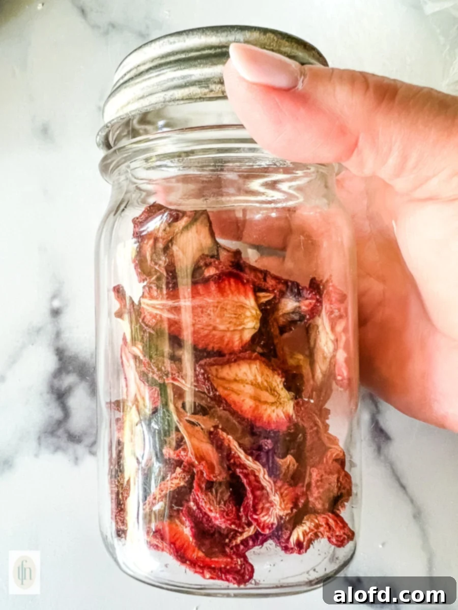 Naturally Dried Strawberries 2 Dehydrated strawberries in a small glass jar.
