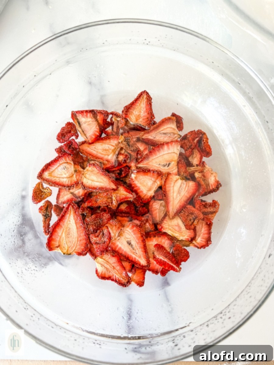 Naturally Dried Strawberries 9 Glass bowl full of sliced berries.