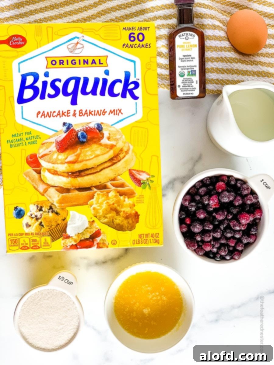 Effortless Bisquick Desserts for Every Event 3 ingredients for making Bisquick Blueberry Muffins which consists of Bisquick original baking mix, sugar, melted butter, frozen blueberries, lemon extract, egg, and whole milk.