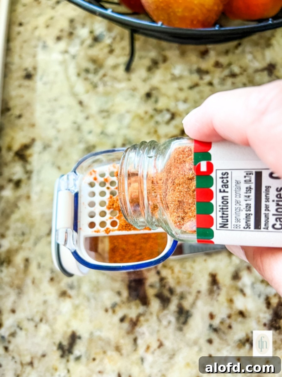 Refilling a spice shaker.
