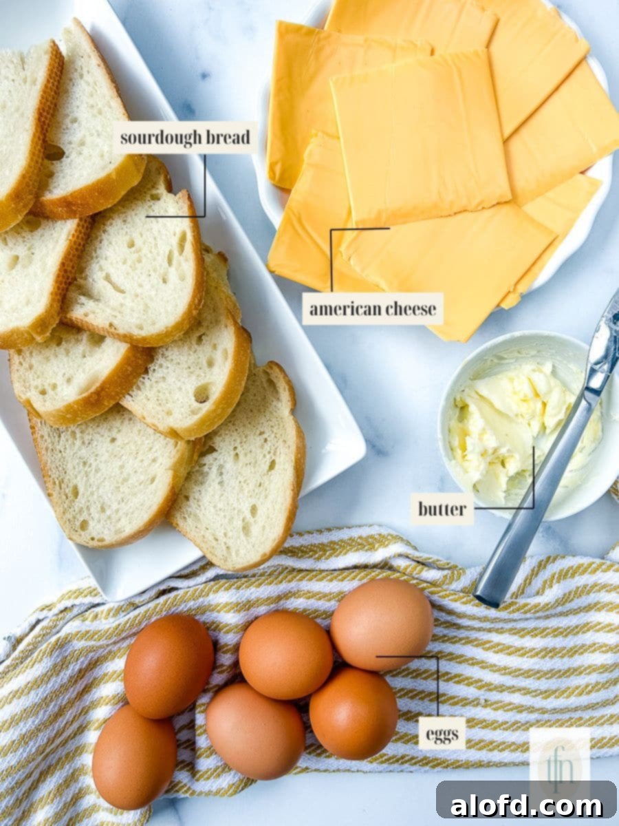Tangy Sourdough Morning Stack 4 Plates of fresh ingredients for a sourdough breakfast sandwich, including bread, eggs, and cheese.