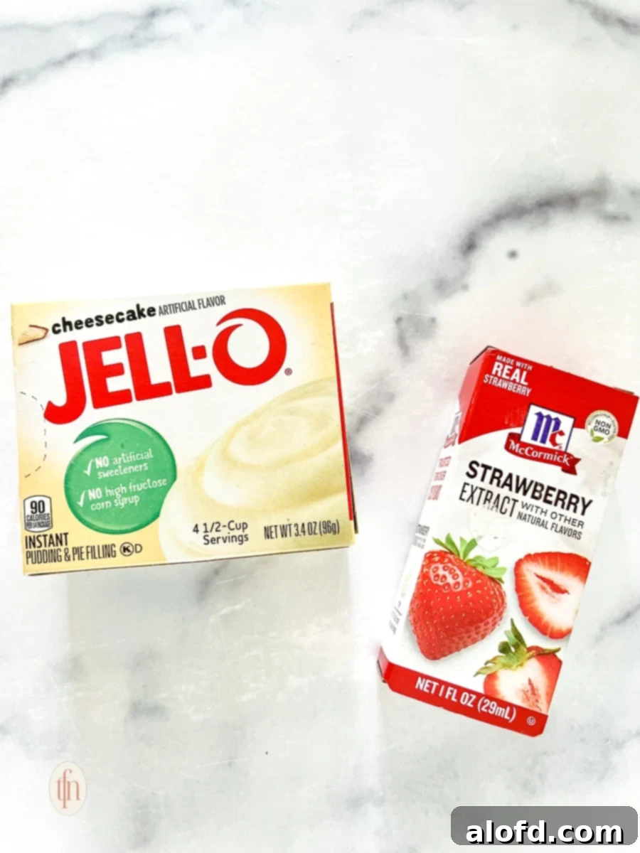 Strawberry Cheesecake Cookie Bliss 4 Package of cheesecake flavored Jello instant pudding mix next to a bottle of strawberry extract for strawberry cookie recipe, ready for baking.