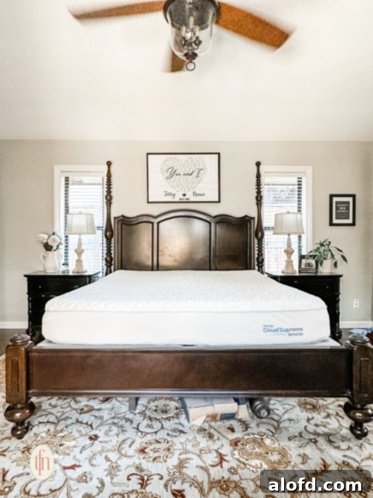 The initial stage of layering a bed, featuring a mattress cover for protection and enhanced comfort.