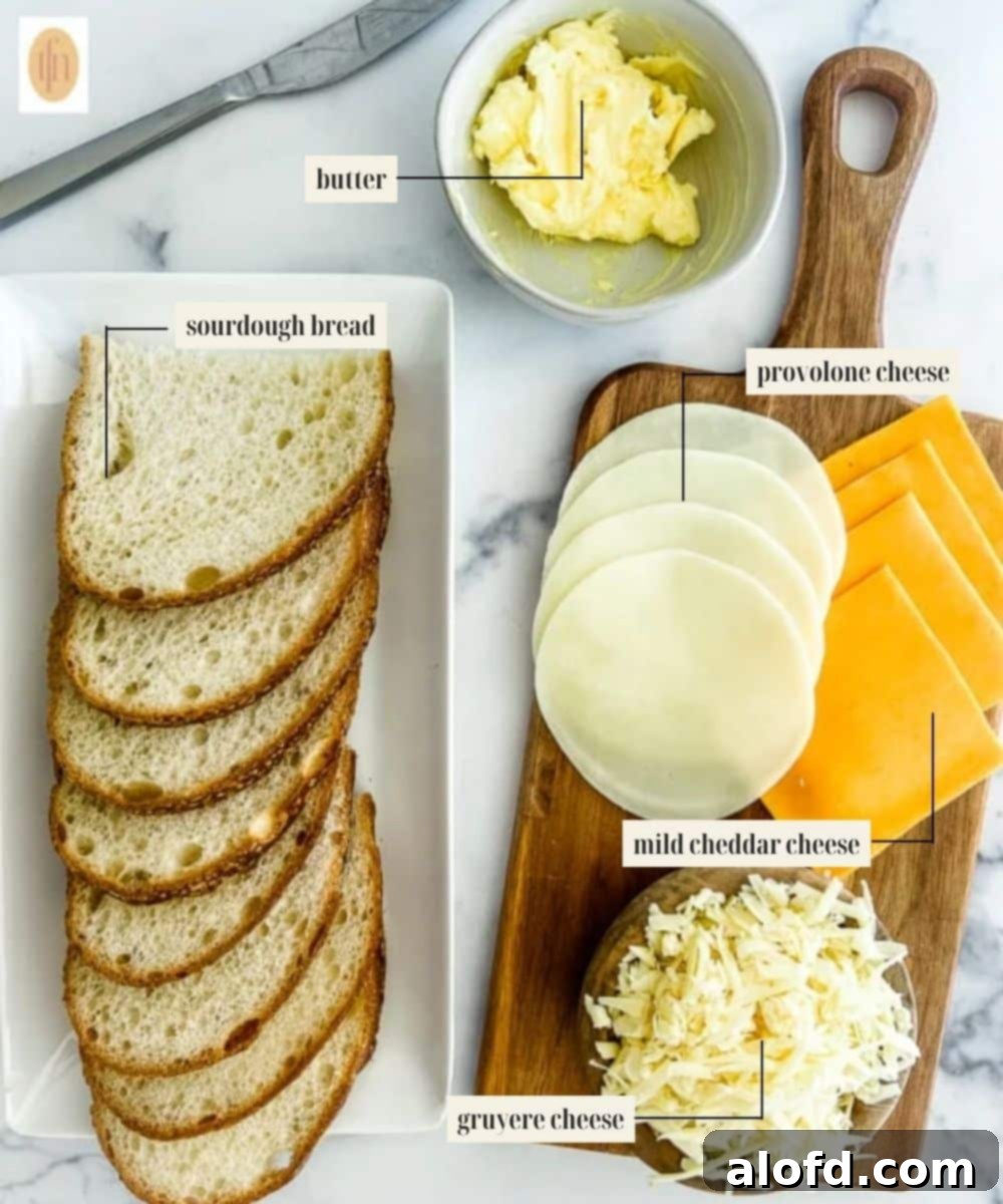 Tangy Sourdough Golden Cheese Melt 3 Labeled ingredients image for a three-cheese sourdough grilled cheese, showing bread, butter, and various cheese slices.