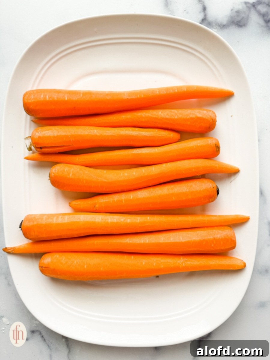 Platter of peeled carrots, ready for shredding.
