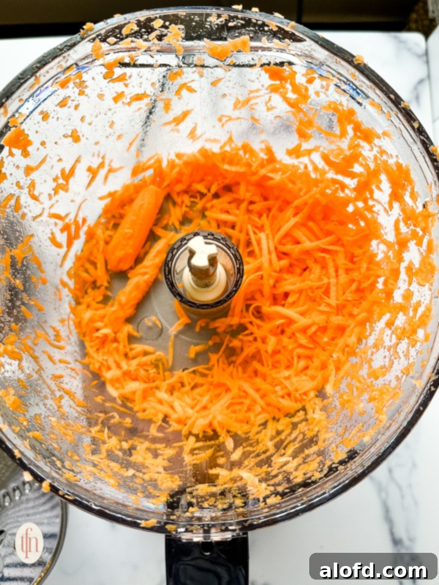 shredded carrots in a food processor.