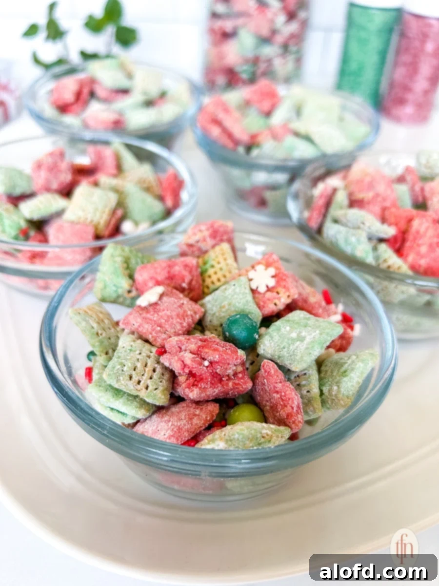 Festive Muddy Buddies 3 Five small glass bowls filled with sweet holiday snack mix.