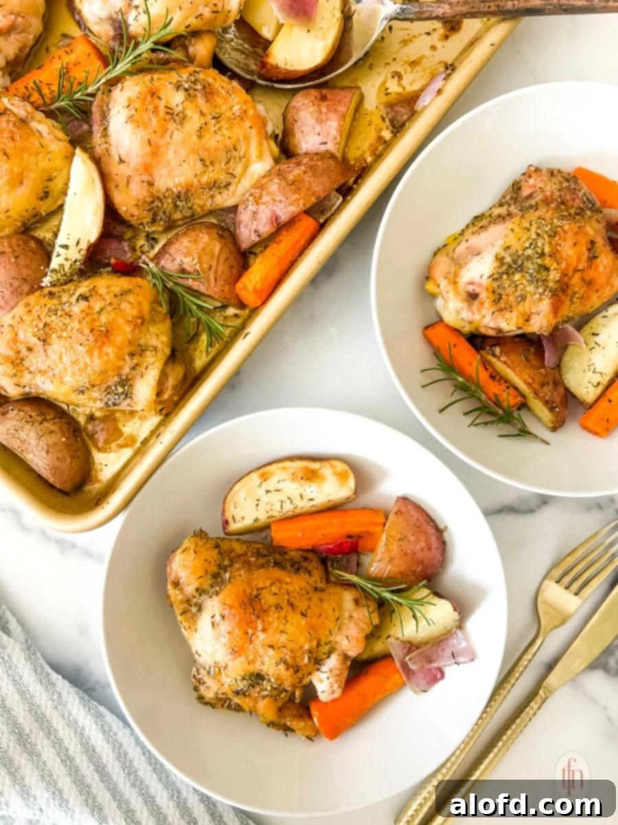 A beautifully plated serving of sheet pan chicken thighs with roasted vegetables, garnished with fresh herbs, ready to enjoy.