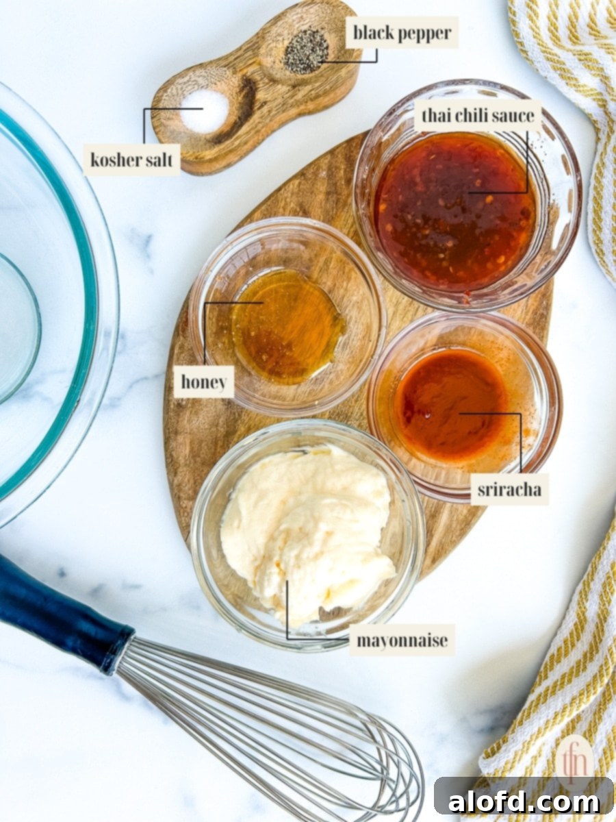 Dynamite Sweet Chili Sauce 5 Labeled ingredients for bang bang sauce recipe laid out: mayonnaise, Thai sweet chili sauce, sriracha, and honey.