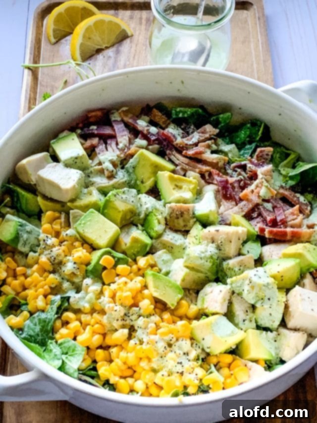 The Ultimate Green Goddess Salad 3 a serving bowl of green goddess chicken Cobb salad.