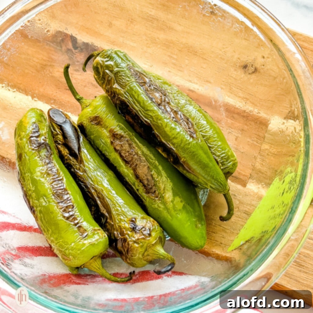 Looking down into a small glass bowl of oven roasted jalapenos.