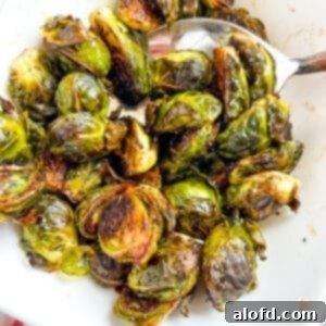 Candied Maple Balsamic Brussel Sprouts, beautifully presented in a square image.