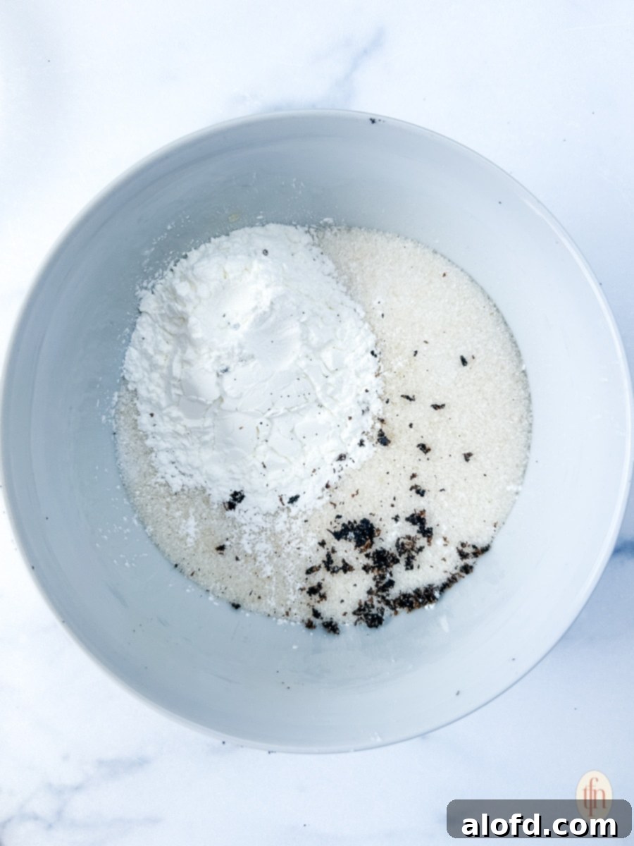 Velvety Vanilla Sauce for Bread Pudding 6 Ingredients combined in a white bowl.