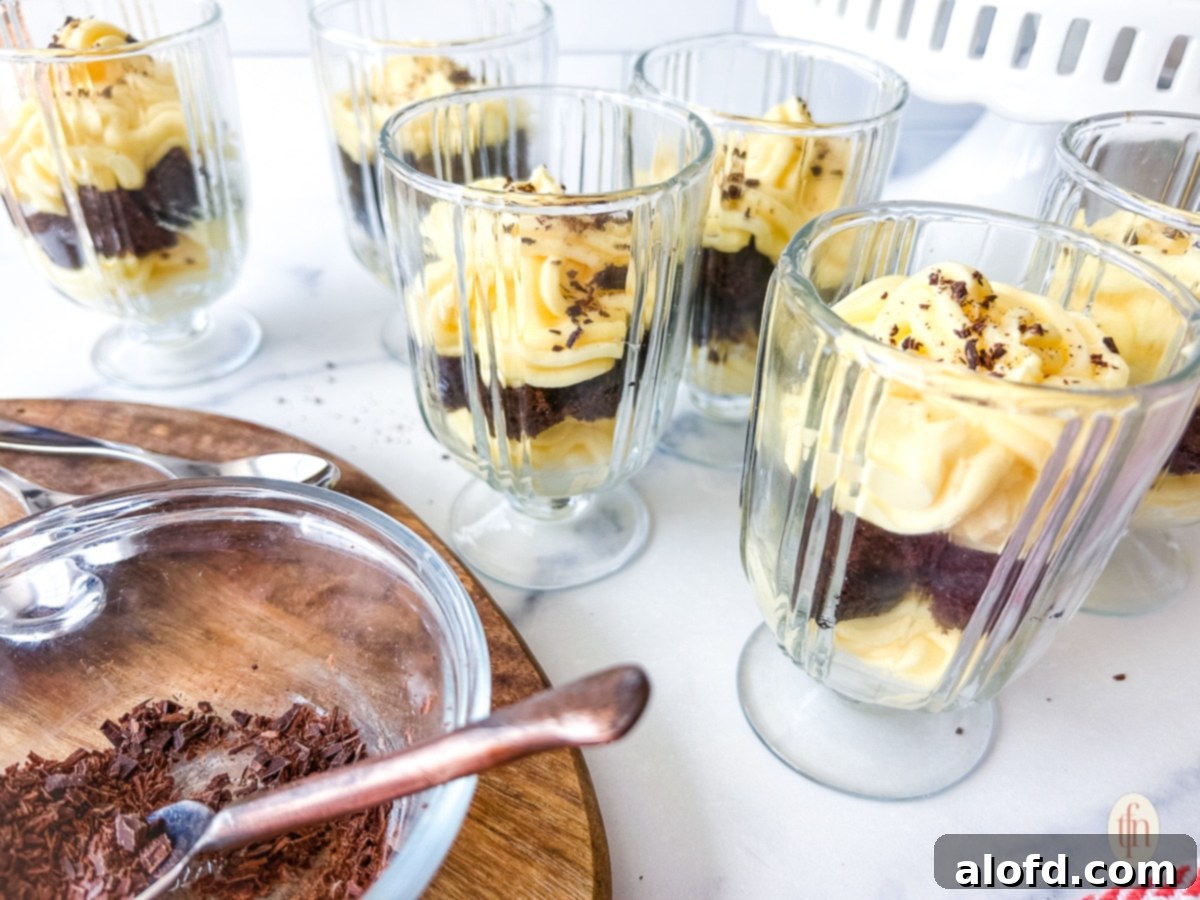 Velvety Vanilla Cloud 10 Glass cups of vanilla parfaits on a white background.