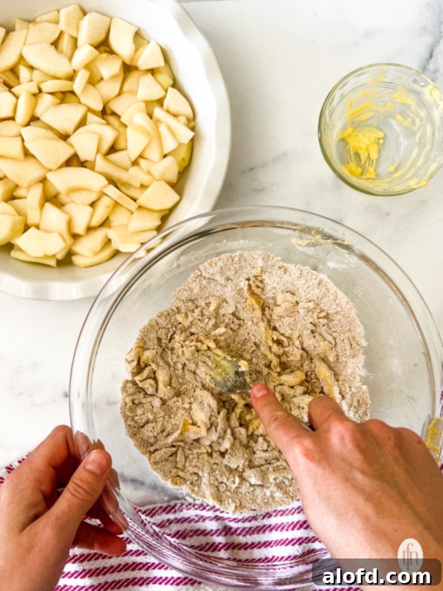Cutting in cold butter with a fork into the dry ingredients. 