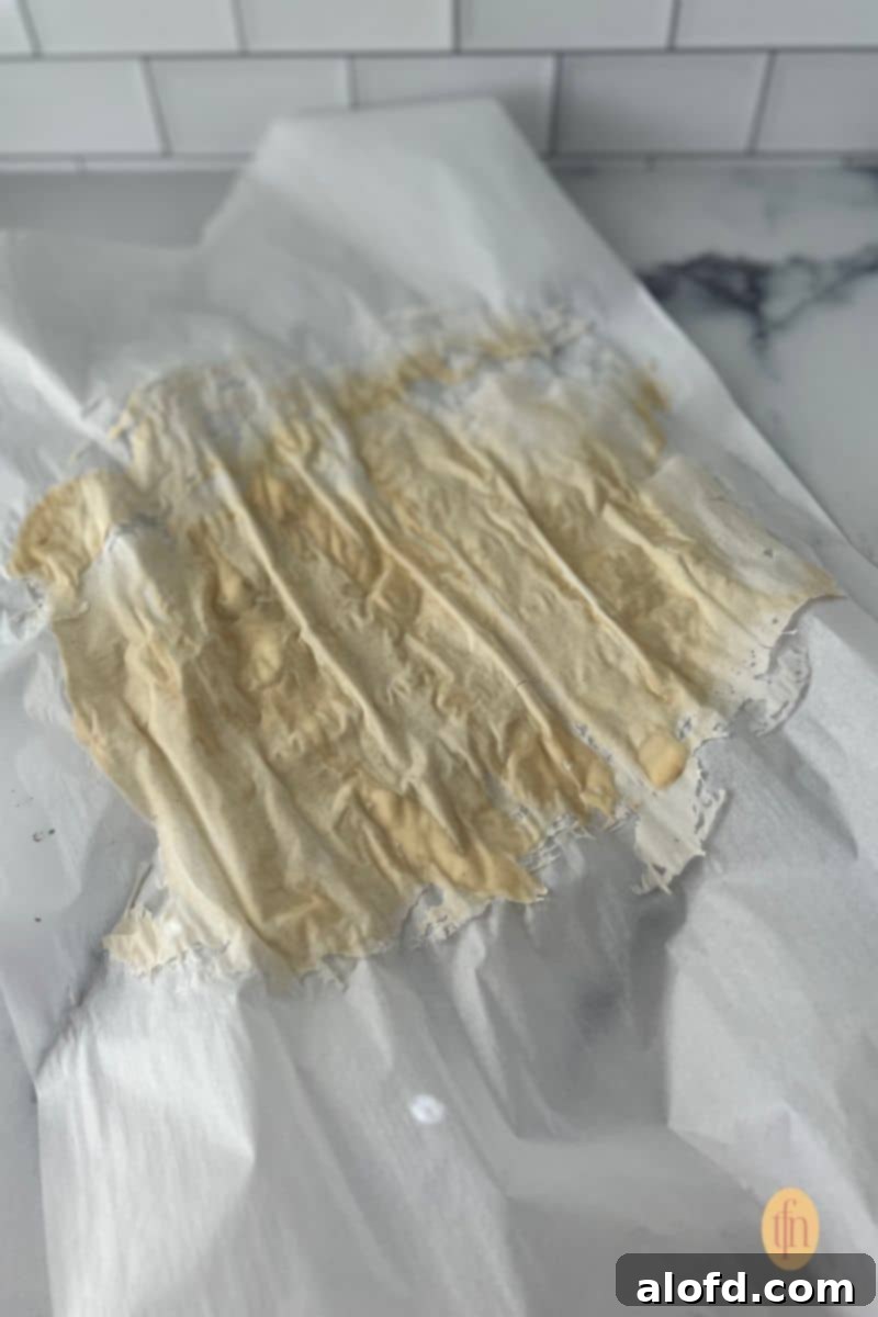 Sourdough Discard Demystified 11 Dried starter on a parchment paper.