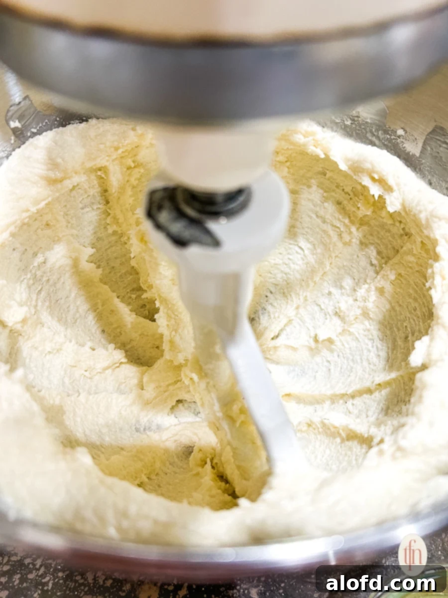 Sweetheart Delights 5 Whipping sugar and butter in a stand mixer, demonstrating the creaming process.
