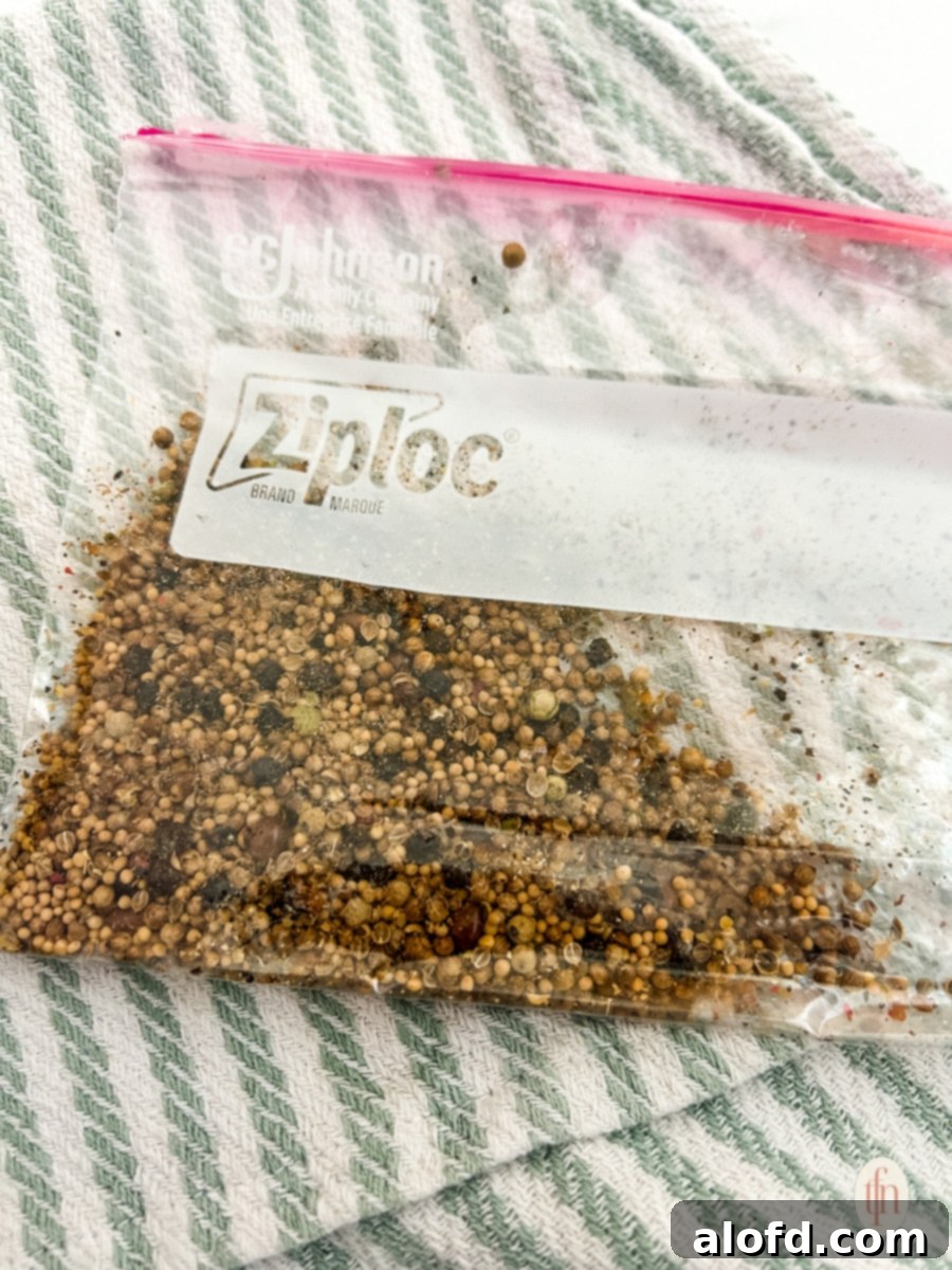 Signature Corned Beef Spice Blend 6 Freshly mixed homemade corned beef seasoning stored inside a clear zip-lock bag, indicating preparation and easy storage.