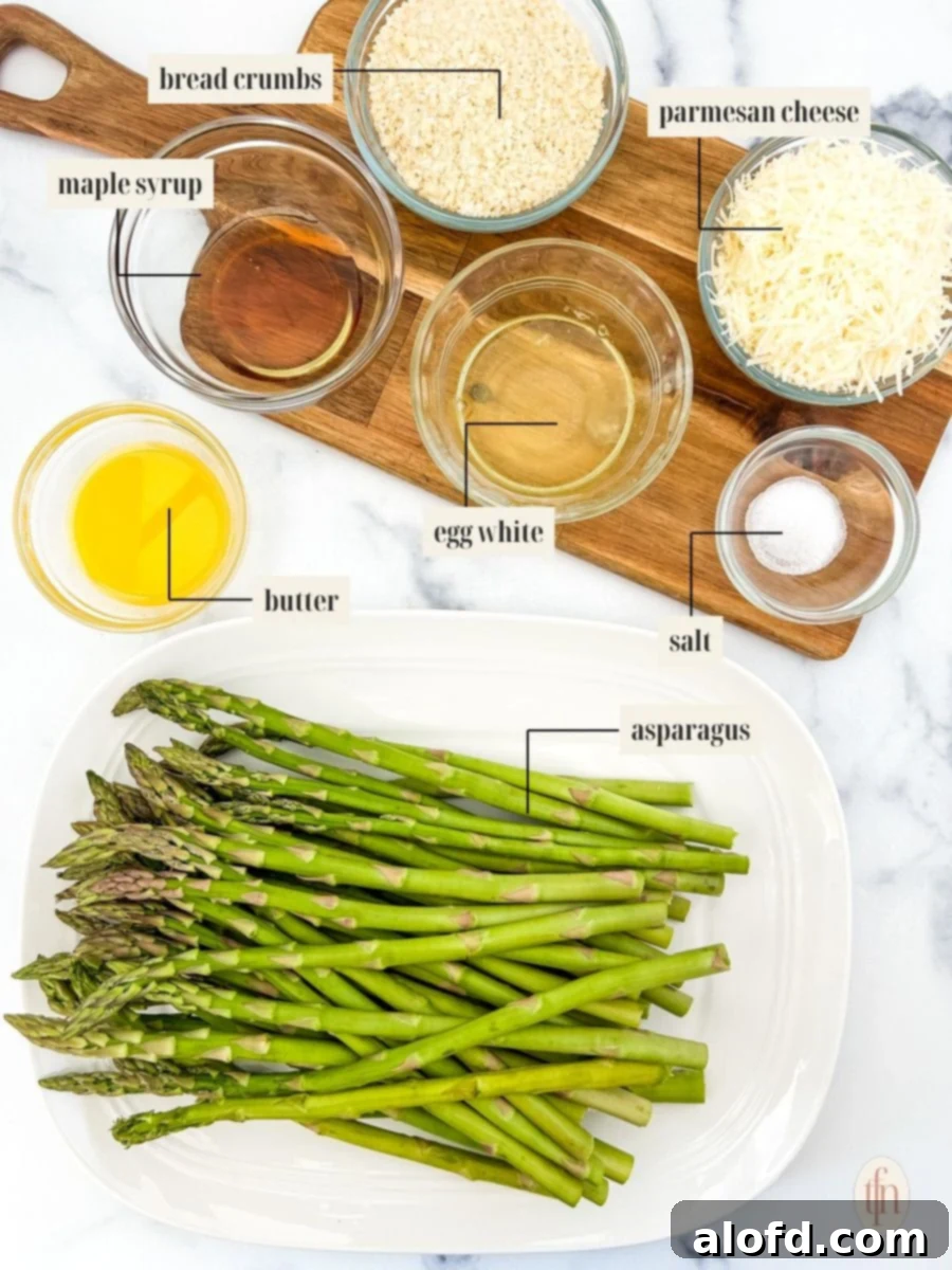Creamy Asparagus Cheese Bake 4 Labeled ingredient image for baked parmesan asparagus recipe, showcasing fresh asparagus, parmesan, breadcrumbs, and other components.